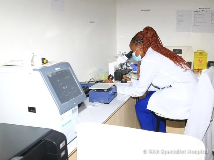 Laboratory technologist analyzing a sample at RKA Specialist Hospital